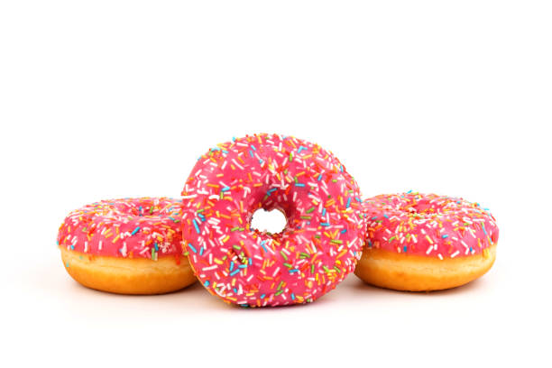 istock Fresh made Donuts isolated on white background. Doughnuts are traditional sweet pastries. Copy space for text. 1312838226