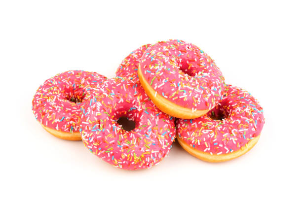 istock Fresh made Donuts isolated on white background. Doughnuts are traditional sweet pastries. Copy space for text. 1312838243