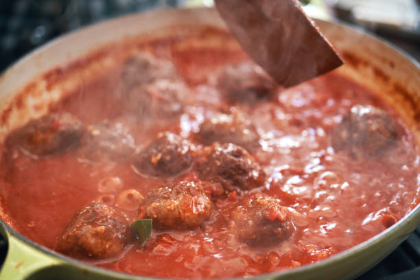 istock Preparing Meatballs with Tomato Sauce in a Pan 1312839711