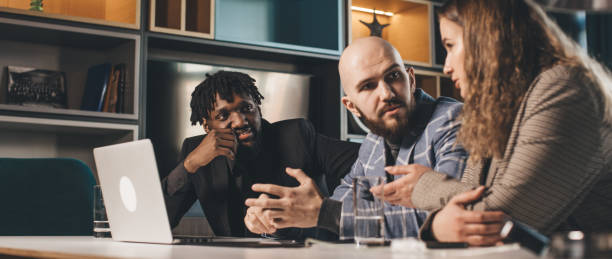istock business meeting. A young development team is discussing a new project. Multiracial team of professionals 1312840144