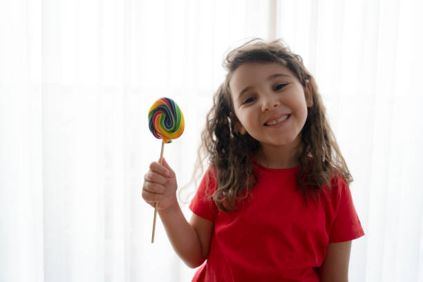 istock Little girl with candy 1312840739