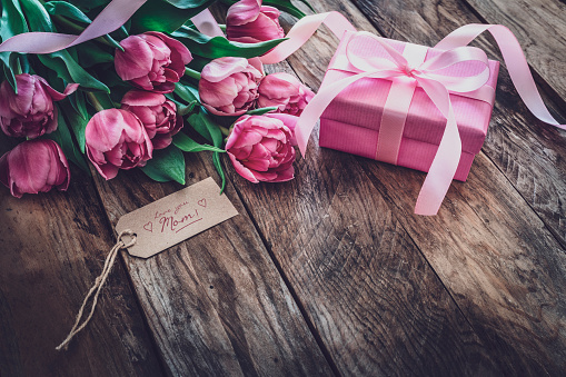 Beautiful pink rose and alstroemeria flowers in a bouquet on soft background