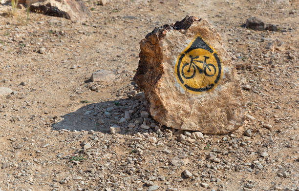 istock bicycle route signpost on a stone in the desert 1312843024