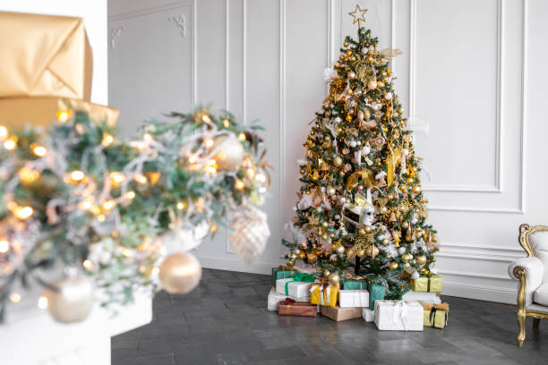 istock decorated christmas tree in a bright interior. New year concept 1312844250