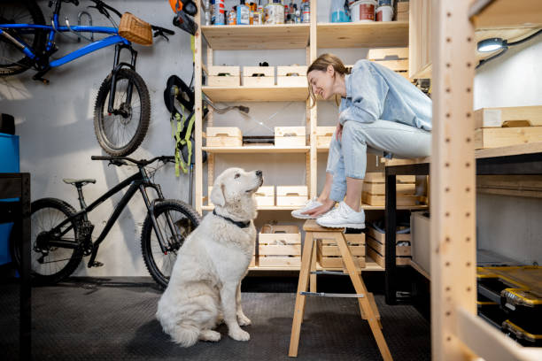 istock Woman with a dog in the workshop 1312844287