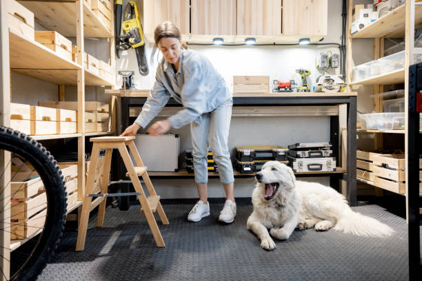 istock Woman with a dog in the workshop 1312844292