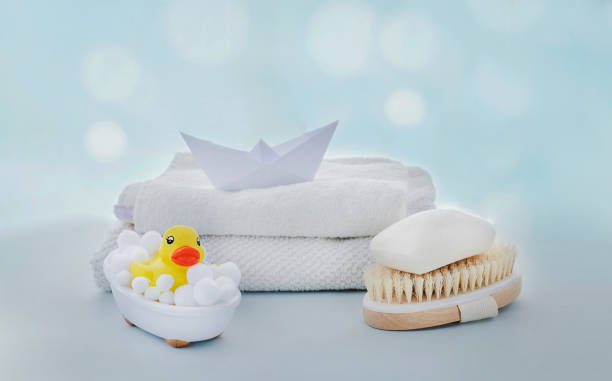 istock Yellow rubber ducky in small bath, natural sponge and soap 1312844398