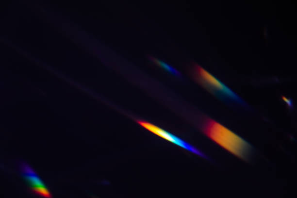 istock colorful warm rainbow crystal light leaks on black background 1312849752