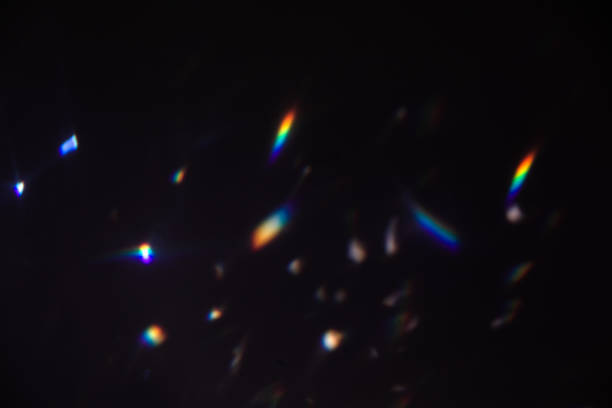 istock colorful warm rainbow crystal light leaks on black background 1312849776