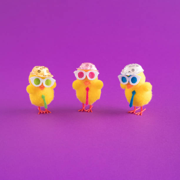 istock Minimal Easter pattern background with party chicken with hat, tie and glasses. Creative party or holiday concept. Copy space. 1312849959