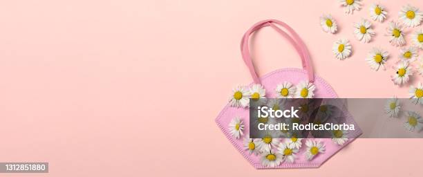 Creative Flat Lay With Daisy Flowers And Pink Fpp2 Or Kn95 Mask Stock Photo - Download Image Now