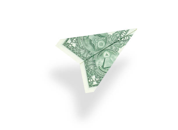 One dollar bill plane isolated on white background One dollar bill plane isolated on white background. Business concept paper airplane photos stock pictures, royalty-free photos & images
