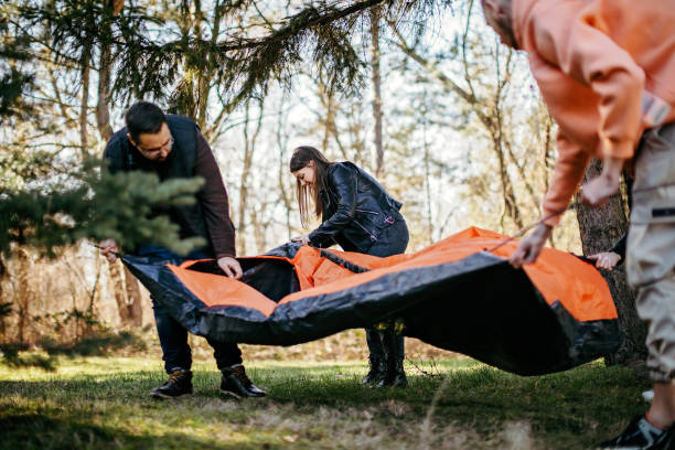 Teenagers start their camping in the woods
