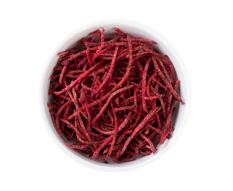 Beetroot strips, julienne style in a bowl isolated over white background.