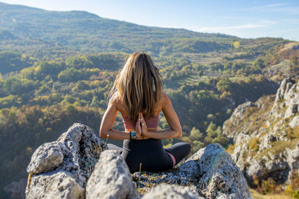 istock Meditation on top of a mountain 1312855015
