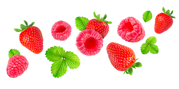 Falling Berries with Green Leaves isolated on white background. Strawberry and Raspberry Concept