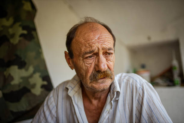 istock Portrait of a lonely old man smoking a cigarette 1312855751