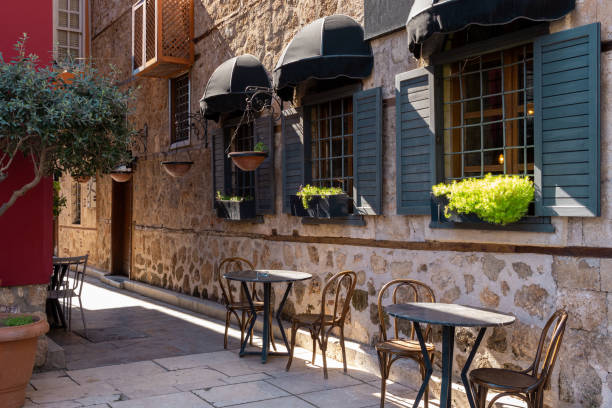 istock Empty tables in cafe in public places in Europe. Cafe and restaurants without customers while tourists season starts. Outcomes of lockdown without travelers. 1312855969
