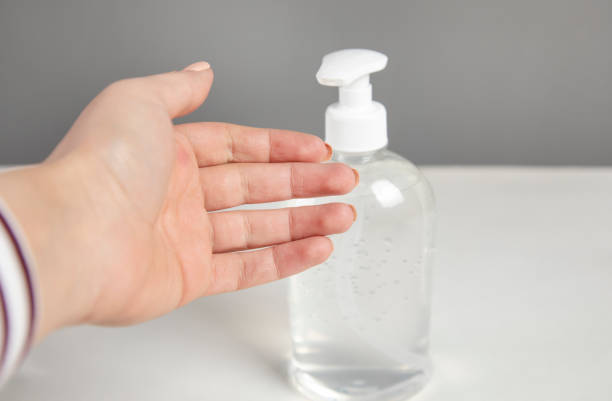 istock Woman hand using alcohol wash gel 1312857698