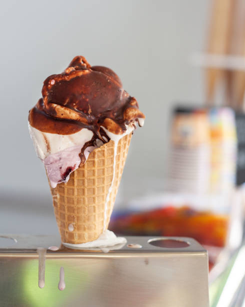 istock Melting ice cream with chocolate on top 1312860813