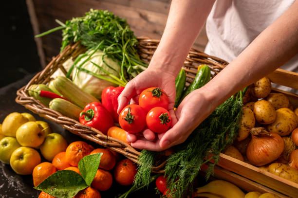 Farmer selling organic veg at market. Rustic style.Healthy food concept Farmer selling organic veg at market. Rustic style.Healthy food concept. High quality photo vegetable stand stock pictures, royalty-free photos & images