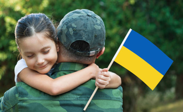 istock Ukrainian Soldier And His Daughter 1312861022