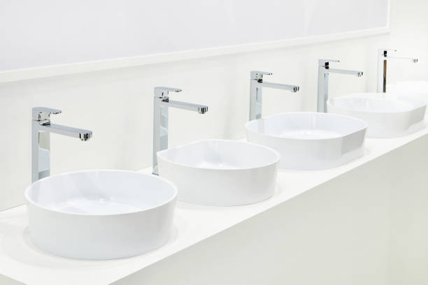 istock Ceramic sinks with faucets for bathrooms 1312862002