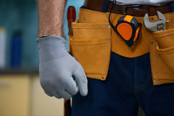 istock Close up of repairman wearing a tool belt with various tools 1312863004