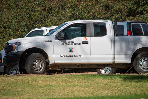 Sylmar, California, United States - October 21, 2020: Los Angeles County Parks and Recreation logo and seal on trucks at a construction project at Veterans Memorial Community Regional Park.