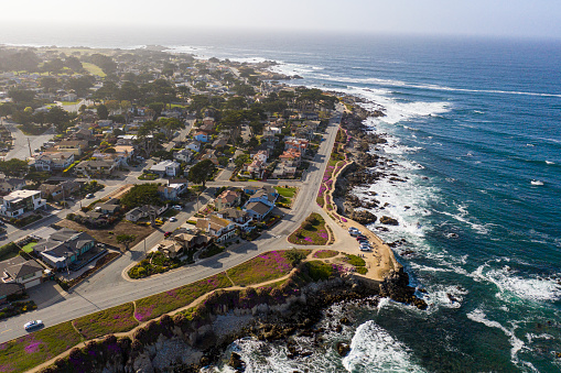 Aerial view of the coastal community of La Jolla, California approximately 10 miles north of downtown San Diego shot via helicopter from an altitude of about 300 feet over the Pacific Ocean.