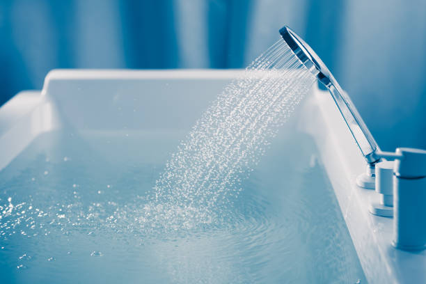 istock shower filling a bathtub with water stream 1312869796