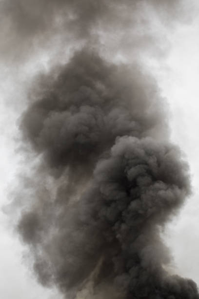 istock black smoke trail of burning house 1312869811
