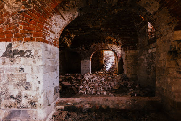 istock Dark and creepy vaulted red brick dungeon 1312870387
