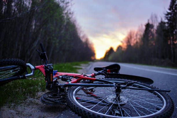 The bike lies on the roadway of the asphalt road in the lem stock photo