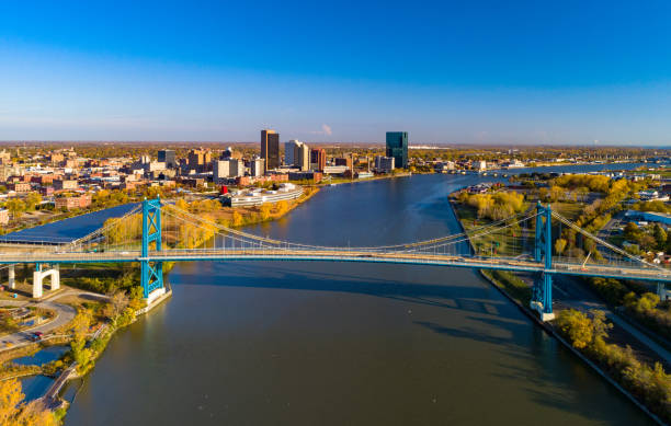 Toledo Skyline, River, and Bridge Aerial View Aerial of Toledo, Ohio, with Downtown Toledo skyline in the background, with the Maumee River and the Anthony Wayne Bridge in the foreground. ohio stock pictures, royalty-free photos & images
