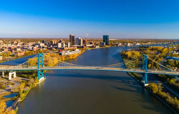 Aerial of Toledo, Ohio, with Downtown Toledo skyline in the background, with the Maumee River and the Anthony Wayne Bridge in the foreground.