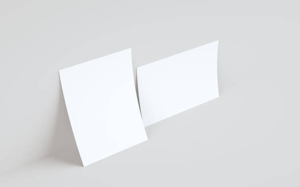 istock A4 Flyer / Letterhead Mock-Up - Two Flyers Against Wall Background 1312878822