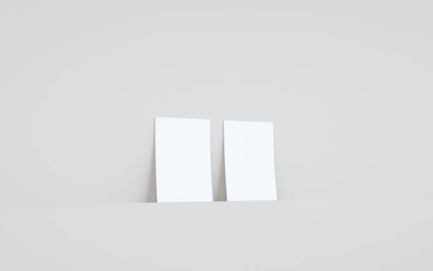 istock A6 Flyer / Brochure Mock-Up - Two Flyers Against Wall Background 1312878826