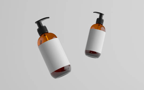 istock Amber Glass Pump Bottle Mock-Up - Liquid Soap, Shampoo Dispenser - Two Floating Bottles. Blank Label 1312878856