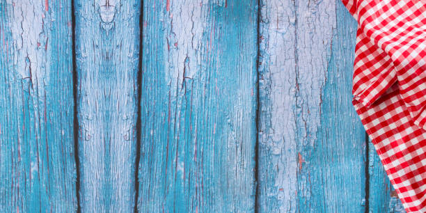 istock Checkered napkin on rustic wooden background, with space for text 1312887284