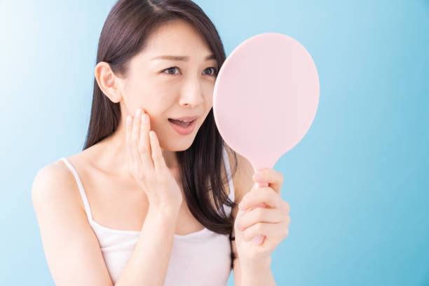 istock attractive asian woman beauty image , mirror 1312889841