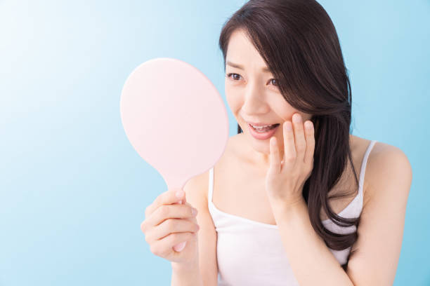 istock attractive asian woman beauty image , mirror 1312889893