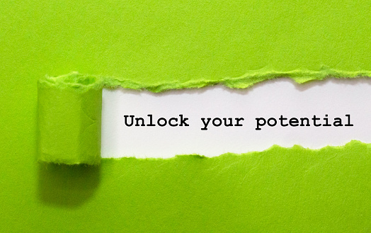 Unlock Your Potential Written Under Green Torn Paper