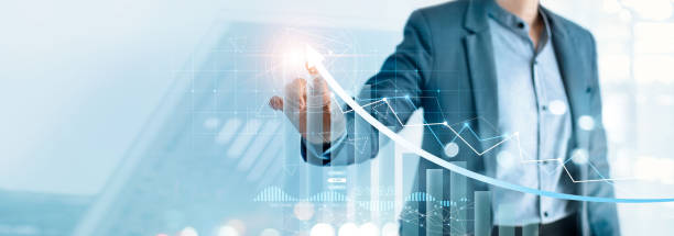 istock Businessman pointing arrow graph growth and financial network connection, analyzing data to increase sales and revenue profit to achieve business investment goal in global economic situation. 1312894650