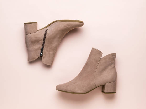 istock Flat lay image of women's beige half-boots on a beige background. 1312899365