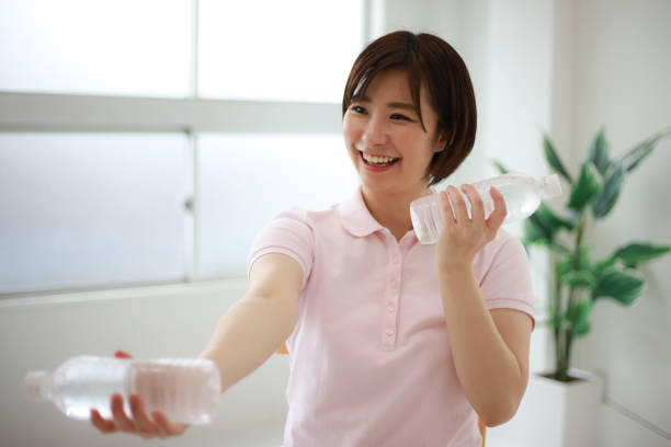 istock Image of a caregiver doing PET bottle exercises 1312899475