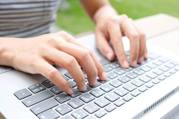 istock New project .The hand of a beautiful woman using the computer She works from home By using connection Of the internet 1312900331