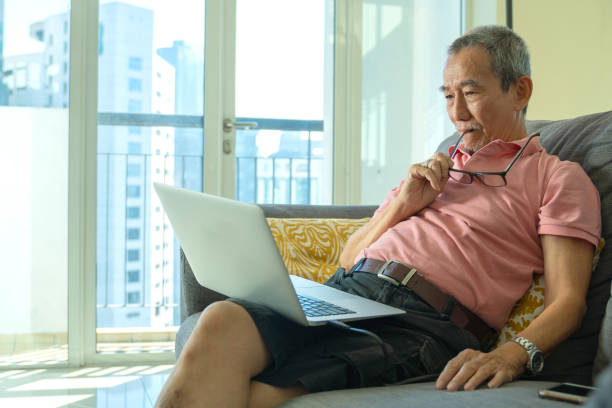 istock Technology concept, senior citizen using laptop at home 1312905424