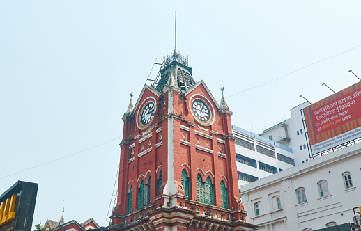 Kolkata, 03-27-2021: Low angle view of the iconic clock tower near the entrance of New Market, city's most popular shopping arena near Esplanade.