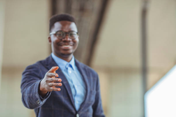 istock Happy Young Businessman Extending Hand To Shake. 1312913109